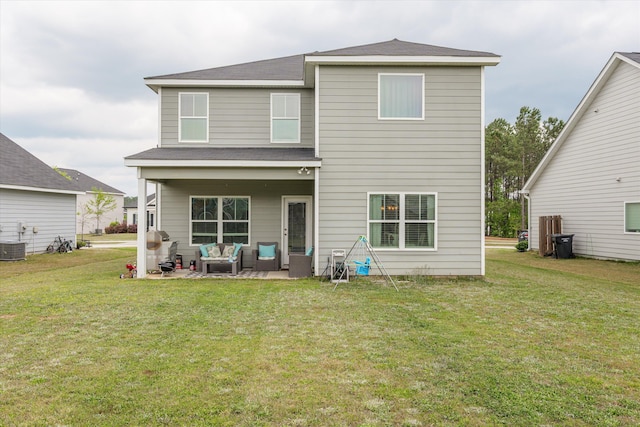 604 Garland Trl, Harlem, GA 30814 - back of property featuring a lawn, roof with shingles, a patio area, and an outdoor hangout area