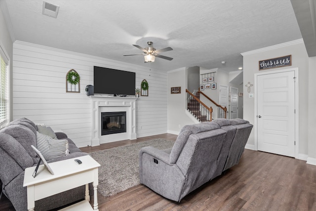 604 Garland Trl, Harlem, GA 30814 - living area featuring wood finished floors, a ceiling fan, stairs, and ornamental molding