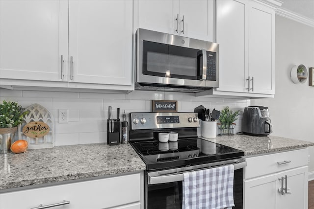 604 Garland Trl, Harlem, GA 30814 - kitchen featuring white cabinets, decorative backsplash, light stone counters, and stainless steel appliances