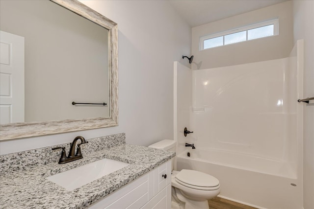 full bathroom with vanity, toilet, and shower / washtub combination