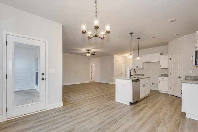 kitchen with white cabinets, decorative light fixtures, a kitchen island with sink, and appliances with stainless steel finishes