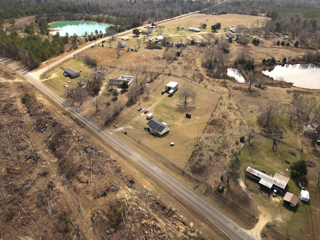 drone / aerial view featuring a water view and a rural view