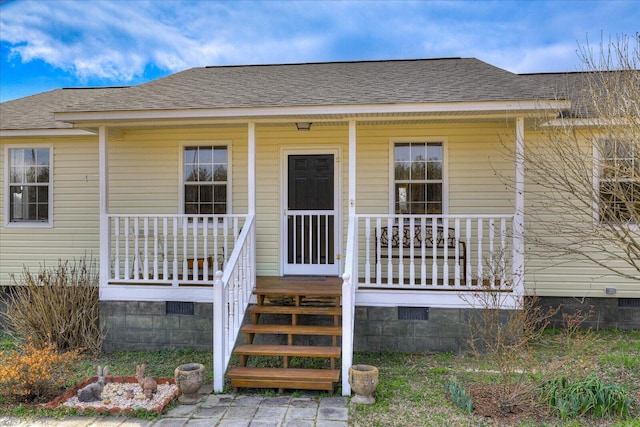 view of front facade with crawl space, a porch, and roof with shingles