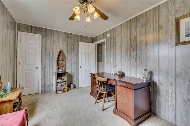 office featuring electric panel, ceiling fan, a textured ceiling, crown molding, and carpet floors