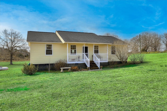 view of front of home with a porch, a front yard, crawl space, and a shingled roof