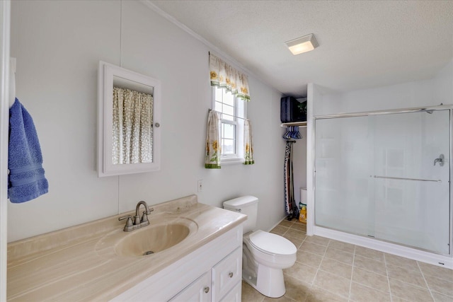 full bath featuring toilet, a shower stall, a textured ceiling, vanity, and tile patterned floors