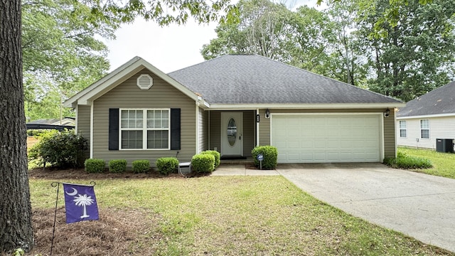 400 SE Pine Ave, Aiken, SC 29803 - view of front facade featuring driveway, an attached garage, a front yard, roof with shingles, and cooling unit