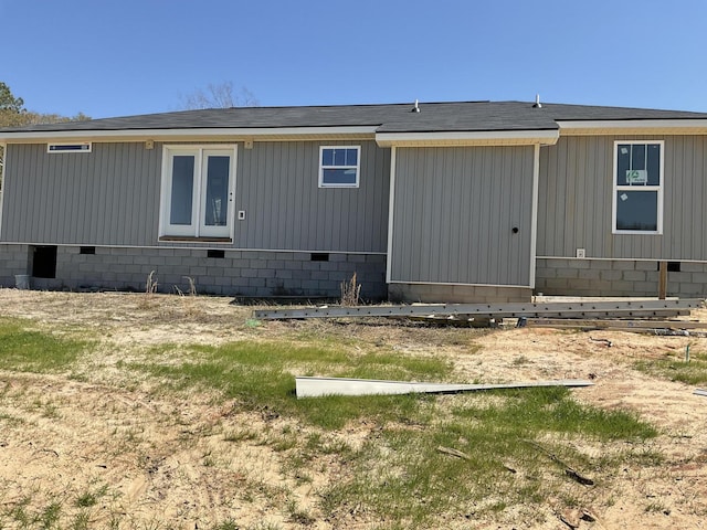 back of house with crawl space