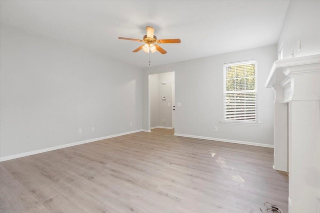 unfurnished living room with ceiling fan and light wood-type flooring