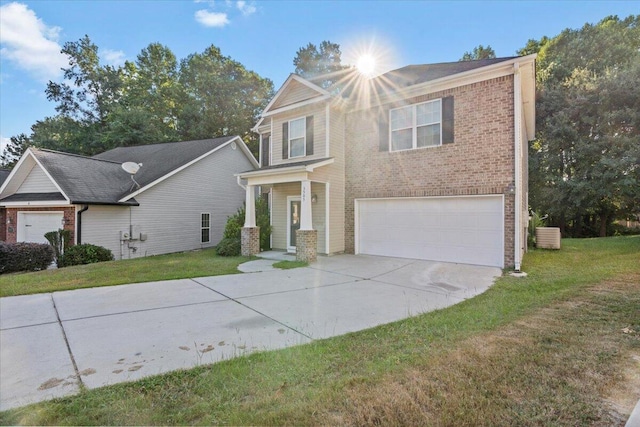 view of front of house featuring a garage and a front lawn