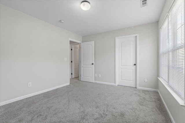 unfurnished bedroom with carpet