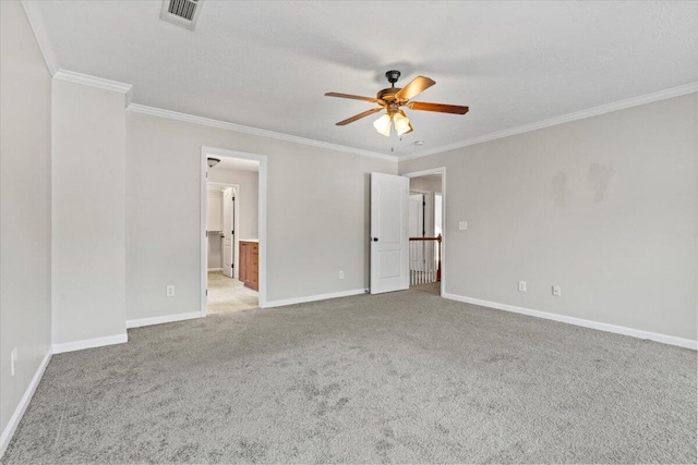 empty room with ceiling fan, light carpet, and ornamental molding