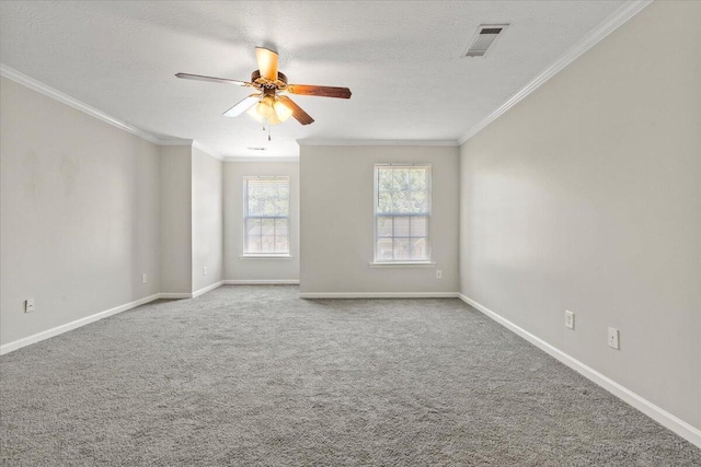 carpeted empty room with crown molding, ceiling fan, and a textured ceiling