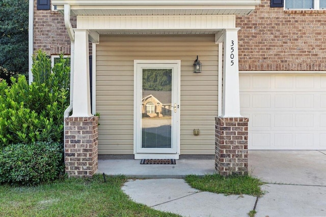 view of exterior entry featuring a garage