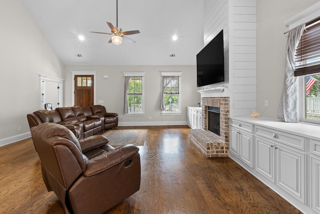 910 Ellis Ln, Evans, GA 30809 - living area with a brick fireplace, healthy amount of natural light, a ceiling fan, baseboards, and high vaulted ceiling