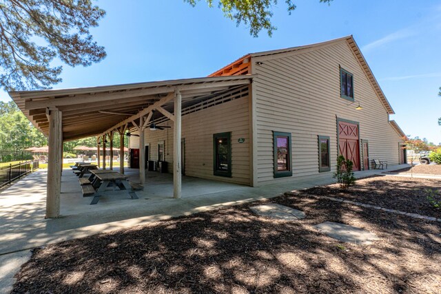 910 Ellis Ln, Evans, GA 30809 - rear view of house with a ceiling fan and a patio