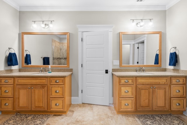 910 Ellis Ln, Evans, GA 30809 - full bathroom with two vanities, ornamental molding, and baseboards