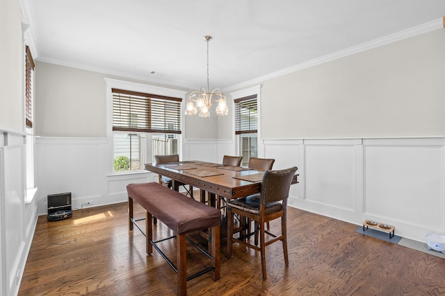 910 Ellis Ln, Evans, GA 30809 - dining space featuring a chandelier, a decorative wall, dark wood-style floors, wainscoting, and crown molding