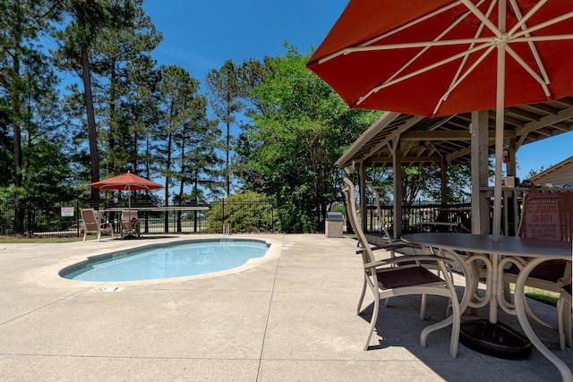 910 Ellis Ln, Evans, GA 30809 - community pool with outdoor dining space, a gazebo, and a patio area