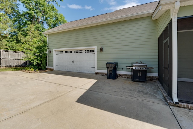 910 Ellis Ln, Evans, GA 30809 - garage with concrete driveway and fence