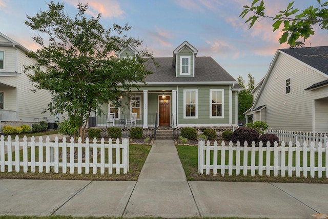 910 Ellis Ln, Evans, GA 30809 - cape cod home featuring covered porch and roof with shingles