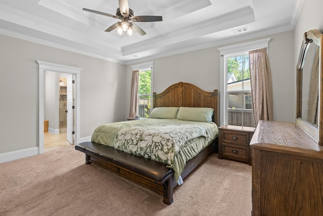 910 Ellis Ln, Evans, GA 30809 - bedroom with a raised ceiling, light carpet, ornamental molding, a ceiling fan, and connected bathroom