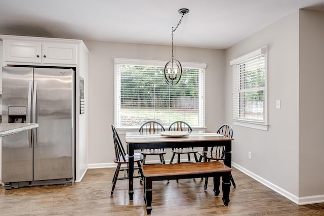621 Cambridge Rd, Augusta, GA 30909 - dining space with a chandelier, wood finished floors, and plenty of natural light