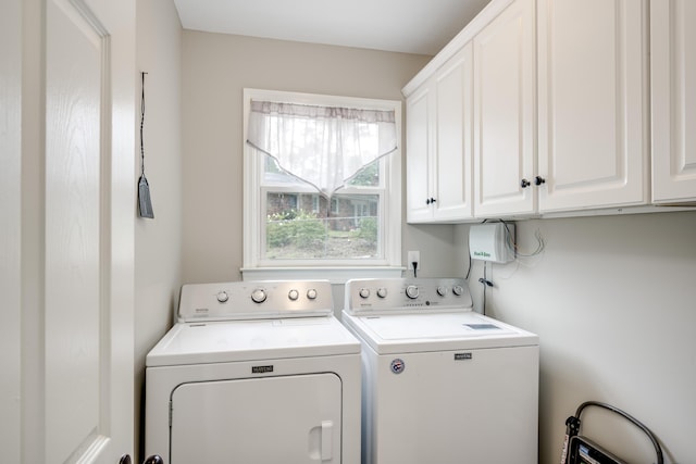 621 Cambridge Rd, Augusta, GA 30909 - laundry area with washer and clothes dryer and cabinet space