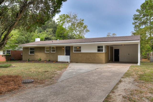 ranch-style house with a front lawn and a carport