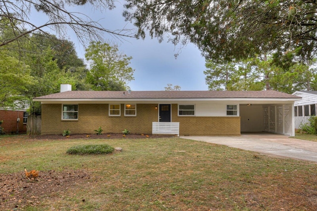 ranch-style house with a carport and a front lawn