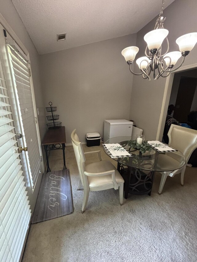 1405 E Thorpe Ln, Aiken, SC 29801 - carpeted dining room featuring a chandelier and a textured ceiling