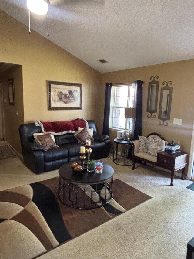 1405 E Thorpe Ln, Aiken, SC 29801 - carpeted living room featuring a textured ceiling, vaulted ceiling, and ceiling fan