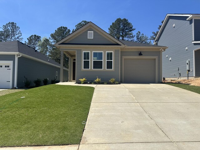 exterior space with a garage and a front lawn