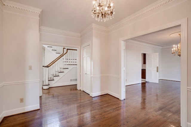 unfurnished room with dark hardwood / wood-style floors and an inviting chandelier