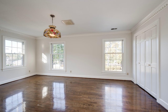 interior space with ornamental molding and a healthy amount of sunlight