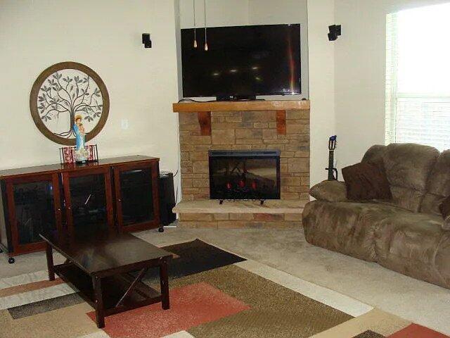 3321 Grove Landing Cir, Grovetown, GA 30813 - living area with a stone fireplace
