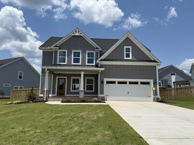 712 Whitney Shoals Rd, Evans, GA 30809 - craftsman house featuring board and batten siding, a porch, concrete driveway, and a standing seam roof
