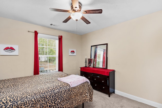 bedroom featuring visible vents, carpet flooring, a ceiling fan, and baseboards