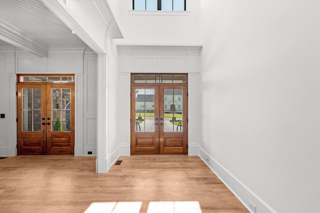 811 Audubon Way, Evans, GA 30809 - entryway with french doors, light wood-type flooring, crown molding, and a decorative wall