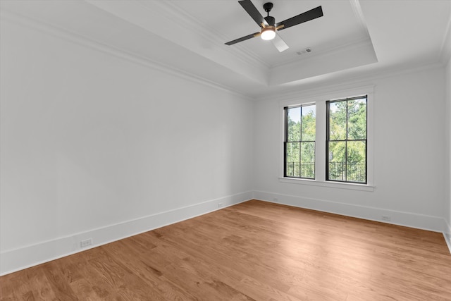 811 Audubon Way, Evans, GA 30809 - empty room with a raised ceiling, light wood finished floors, ornamental molding, and ceiling fan