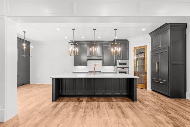 811 Audubon Way, Evans, GA 30809 - kitchen with stainless steel oven, light countertops, light wood finished floors, crown molding, and recessed lighting
