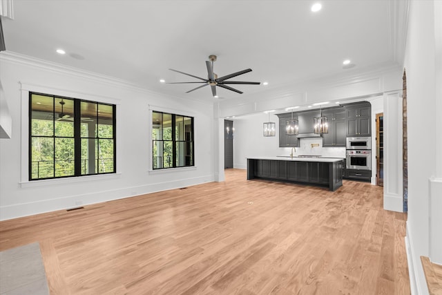 811 Audubon Way, Evans, GA 30809 - unfurnished living room with ornamental molding, ceiling fan, light wood finished floors, and recessed lighting