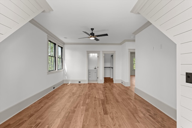 811 Audubon Way, Evans, GA 30809 - unfurnished living room with light wood-style flooring, ceiling fan, and ornamental molding