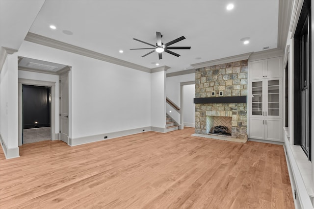 811 Audubon Way, Evans, GA 30809 - unfurnished living room with ceiling fan, crown molding, light wood-type flooring, stairs, and a fireplace