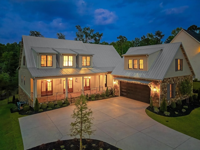 811 Audubon Way, Evans, GA 30809 - modern inspired farmhouse featuring covered porch, driveway, stone siding, a metal roof, and a front yard