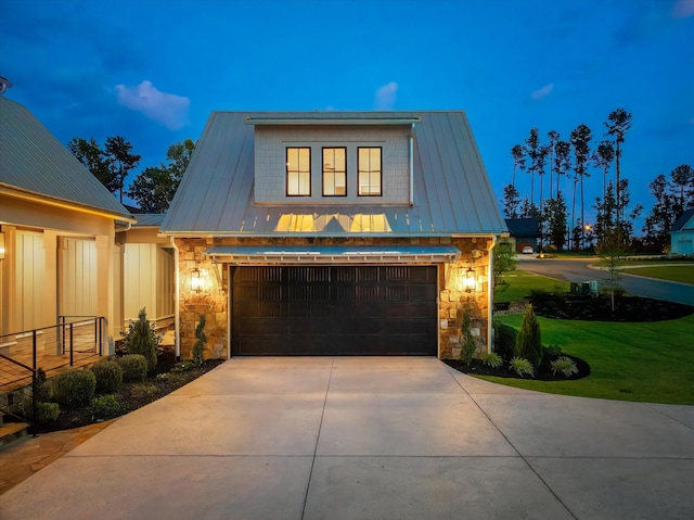 811 Audubon Way, Evans, GA 30809 - view of front of home with stone siding, concrete driveway, a front lawn, and a metal roof