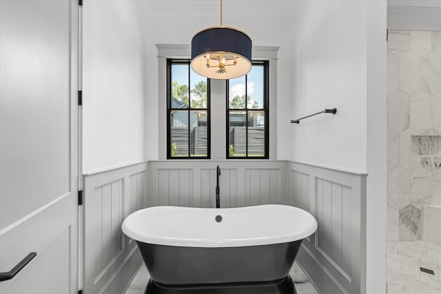 811 Audubon Way, Evans, GA 30809 - bathroom featuring a soaking tub, a decorative wall, a wainscoted wall, ornamental molding, and tiled shower