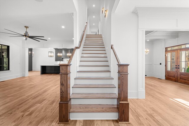 811 Audubon Way, Evans, GA 30809 - staircase featuring crown molding, wood finished floors, ceiling fan, recessed lighting, and french doors