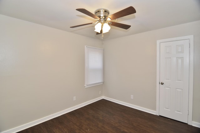 empty room featuring dark hardwood / wood-style floors and ceiling fan