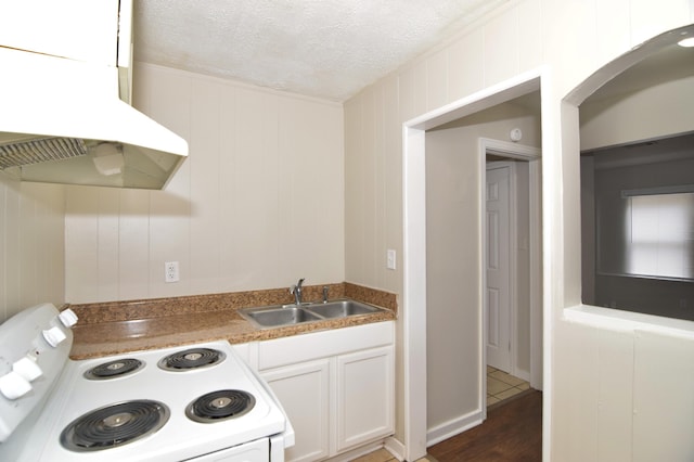 kitchen featuring dark hardwood / wood-style flooring, extractor fan, white range with electric stovetop, sink, and white cabinetry